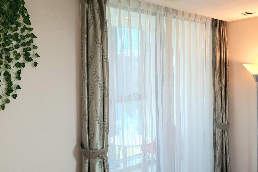 Haeundai Beach 1 Cho Apartment ปูซาน ภายนอก รูปภาพ